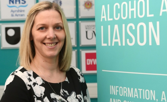 Ayrshire College Alcohol Liaison Officer standing beside banner at the Kilmarnock Campus