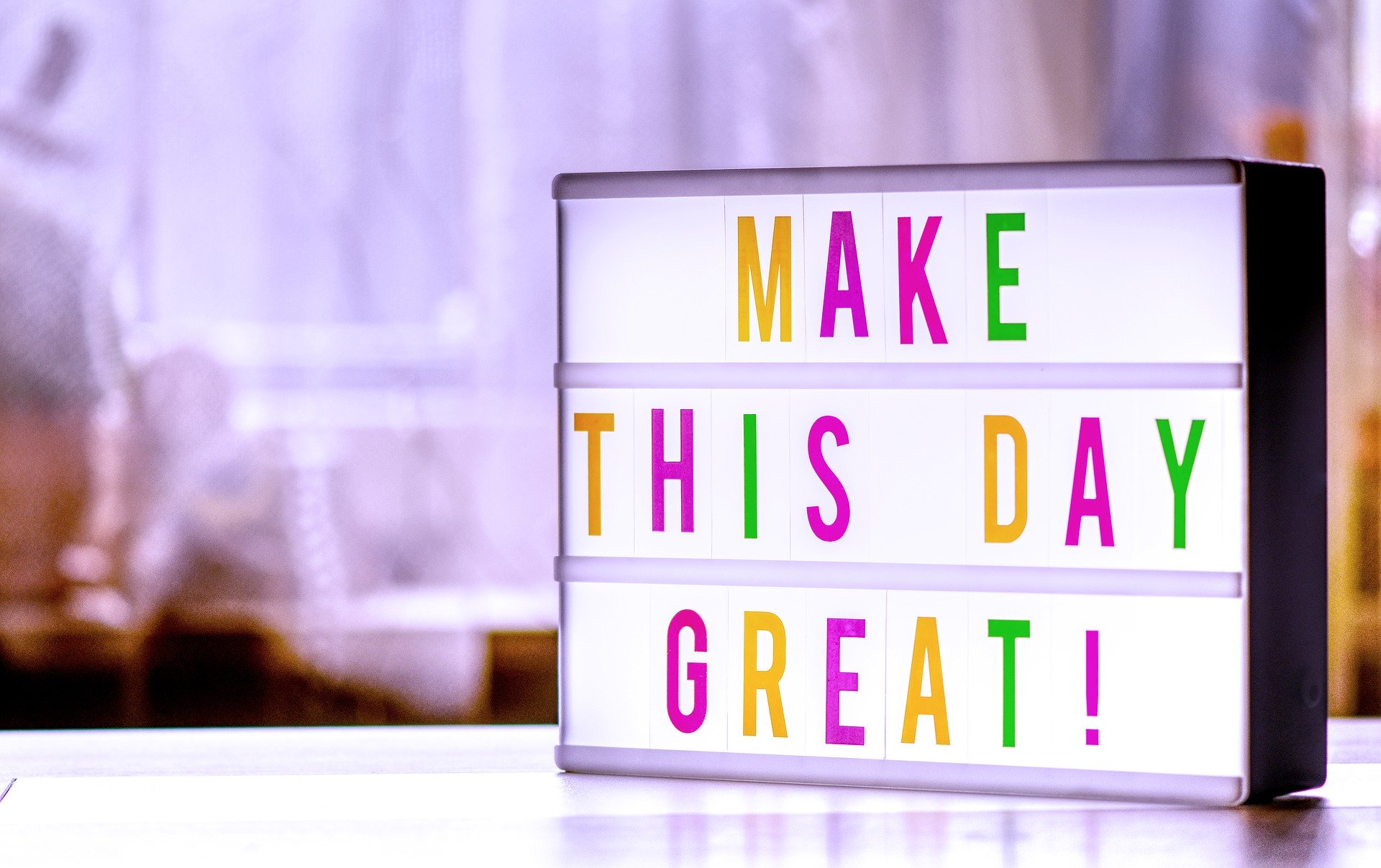A lightbox sign saying Make This Day Great!
