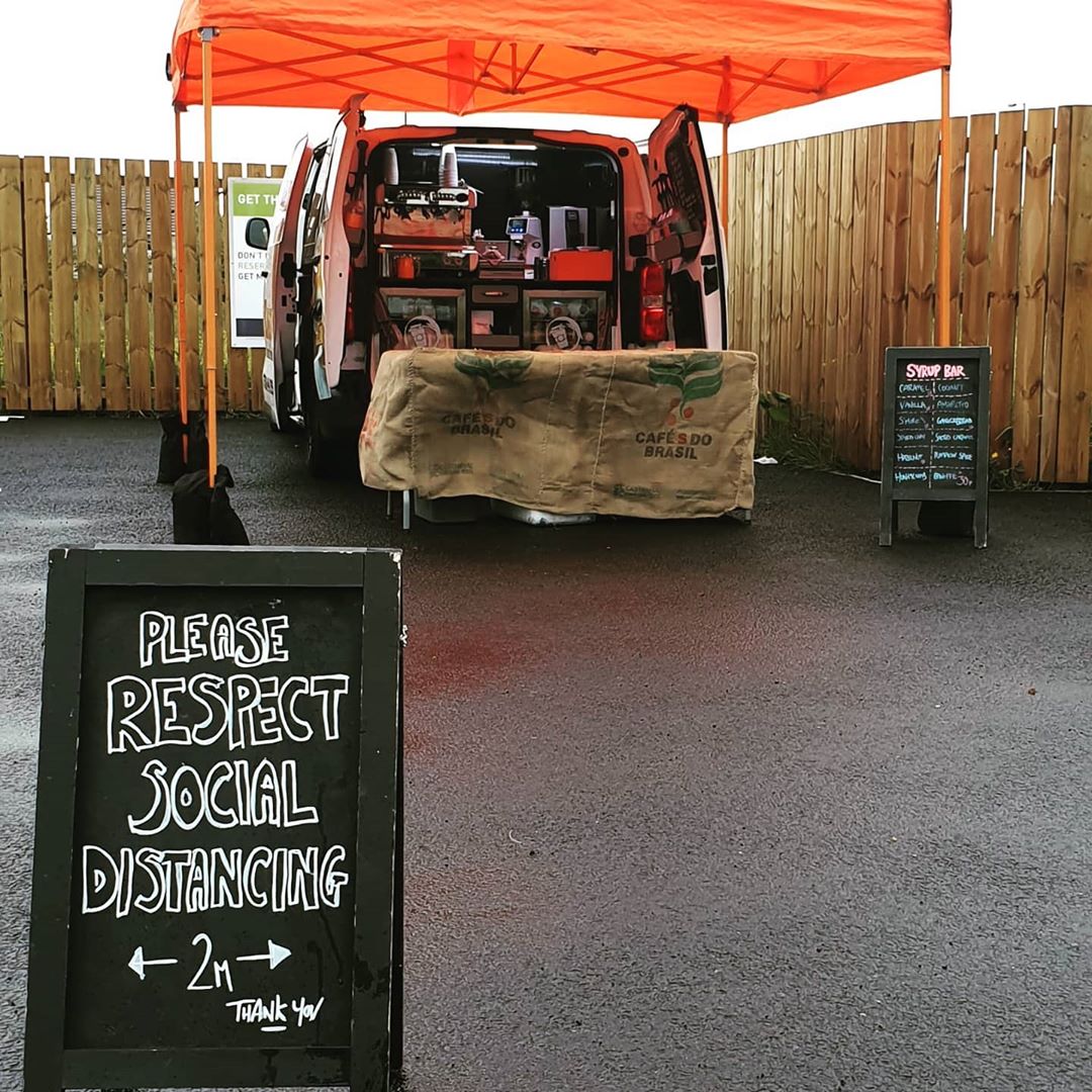 A social distancing sign used in front of the mobile coffee van, the Espresso Kart